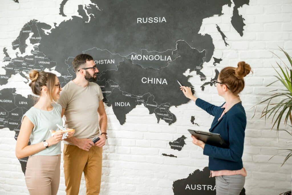 Couple with travel agent at the office