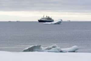 Expedition ship navigating icy waters