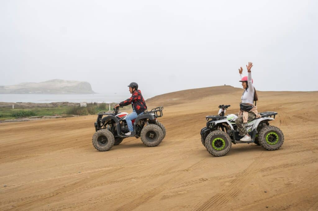 Friends on a free ride with quad bikes